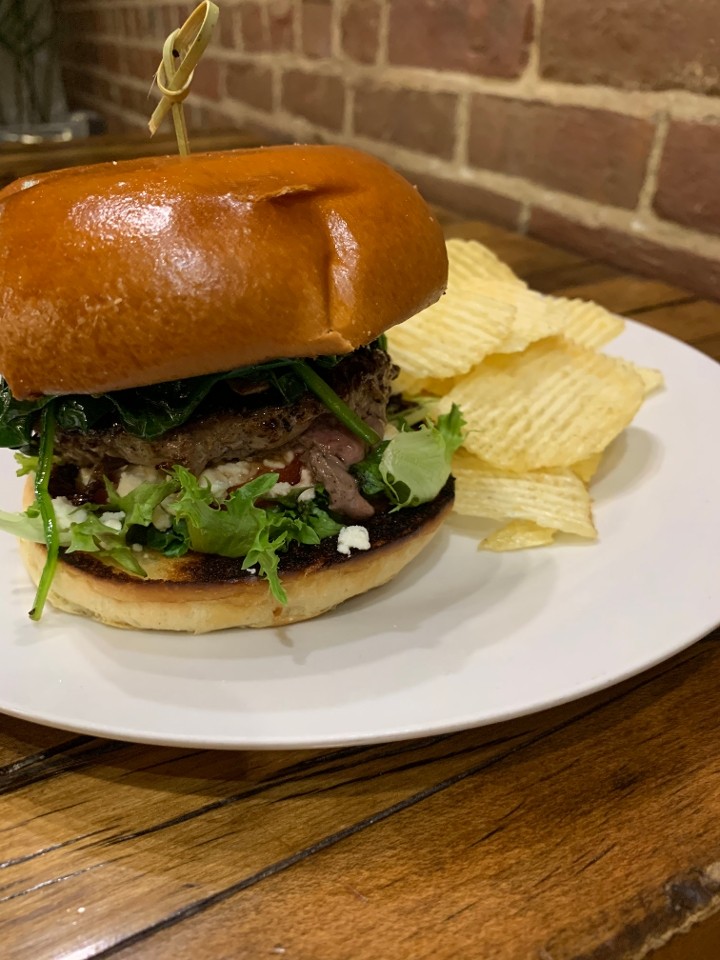 Mediterranean Burger (Local, grass fed beef burger with Spinach, Mushrooms, Feta, red onion, lettuce, tomato) served with chips