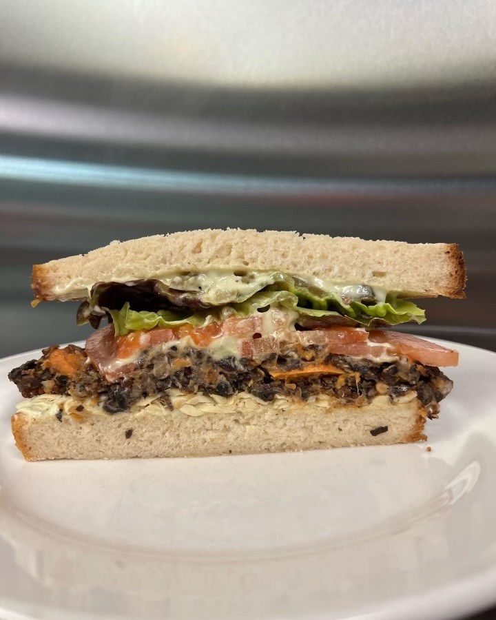 Organic Black Bean Patty Sandwich with Cashew Cheese, Sour Cream, Lettuce, Tomato and Jalapeño