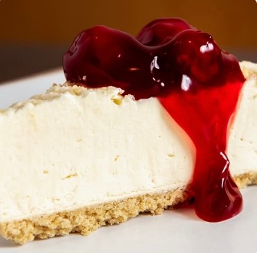 Slice Cheesecake with Cherry Topping