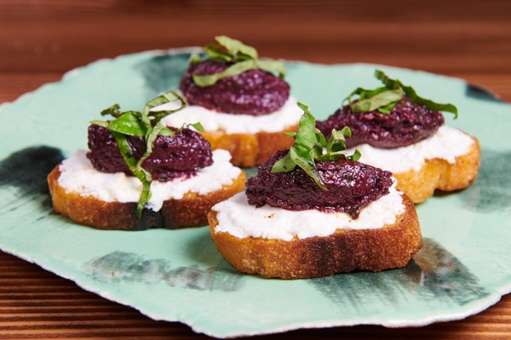 GOAT CHEESE + OLIVE TAPENADE CROSTINI