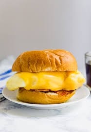 Two eggs with cheese on a roll