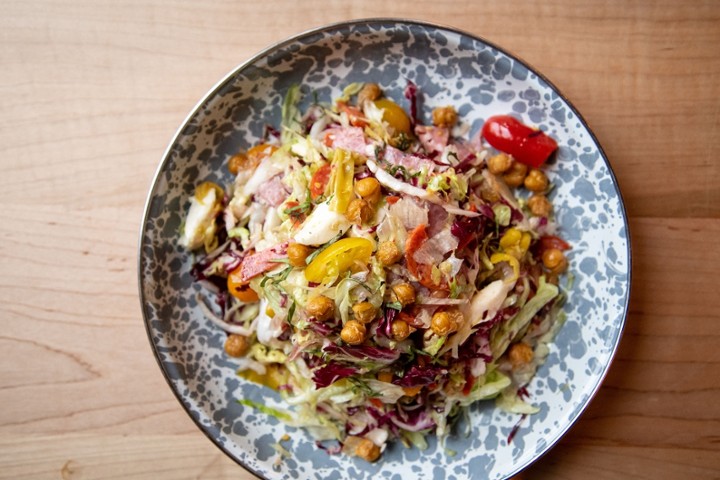 Olivia’s Chopped Salad, Mozzarella, Tomatoes, Salami, Pepperoni, Pickled Peppers, Crispy Chickpeas, Wild Oregano Vinaigrette