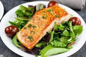 Seared salmon over salad