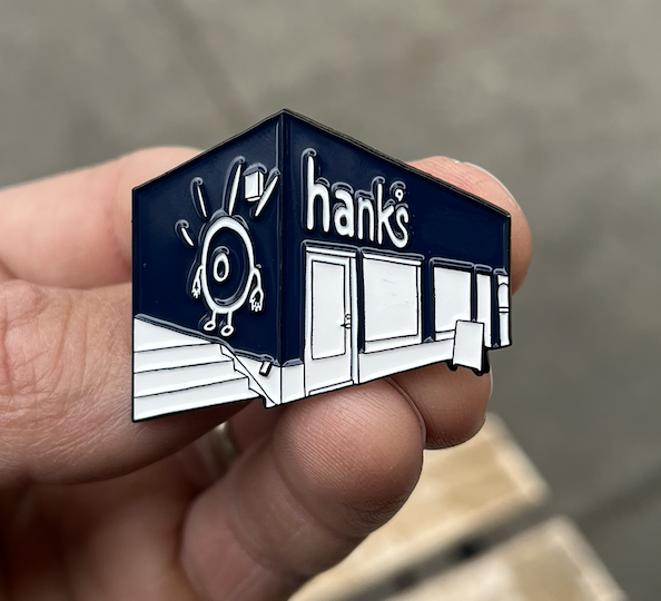 Hank's Storefront Enamel Pin