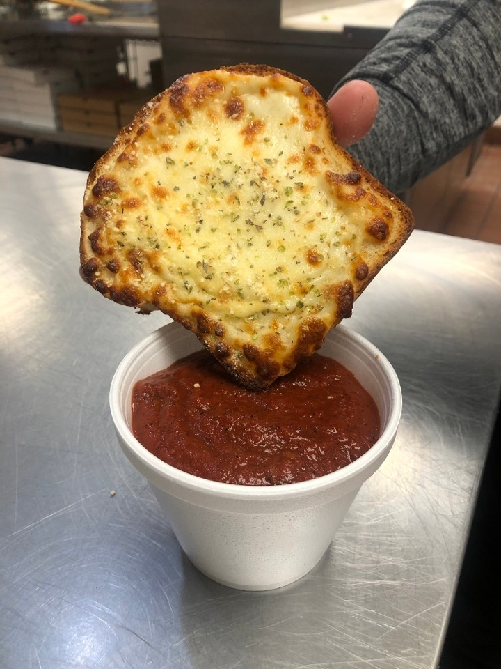 Side cup of pizza sauce