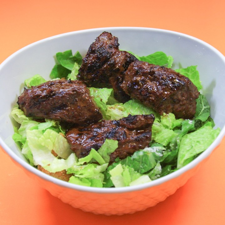 Steak Tips on Caesar Salad