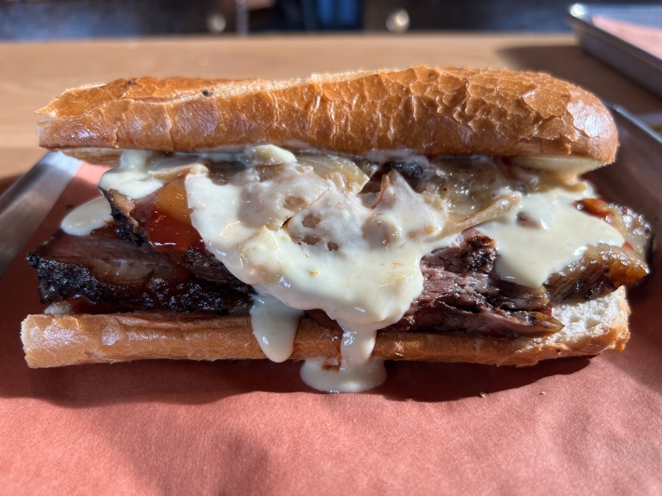 Smothered Queso Brisket Roll