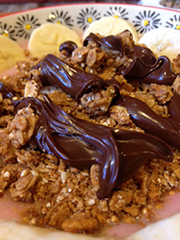 NAUGHTY BUT NICE BOWL - banana, strawberries, house-made almond milk.  Topped banana, vegan Nocciolata (chocolate hazelnut spread)