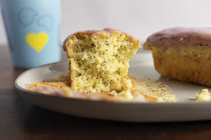 gluten free lemon poppyseed muffin with blueberry glaze