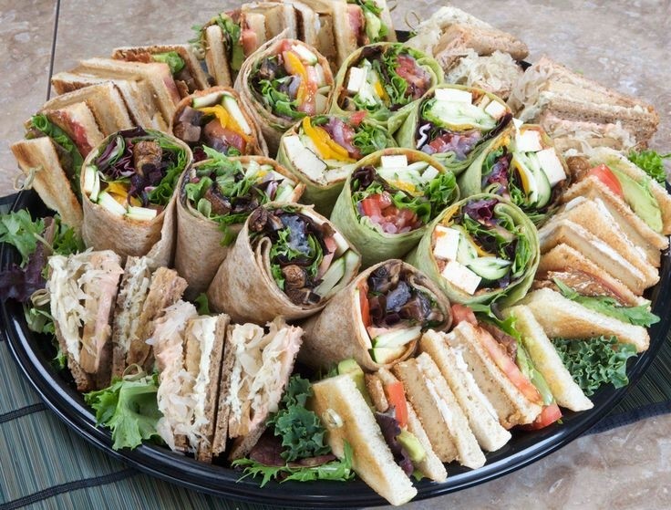Assorted Sandwich platter, chips, pickle, pasta salad