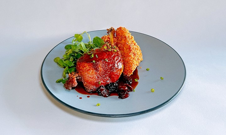 Crispy Duck Confit w/ red wine cherry just and potato croquette