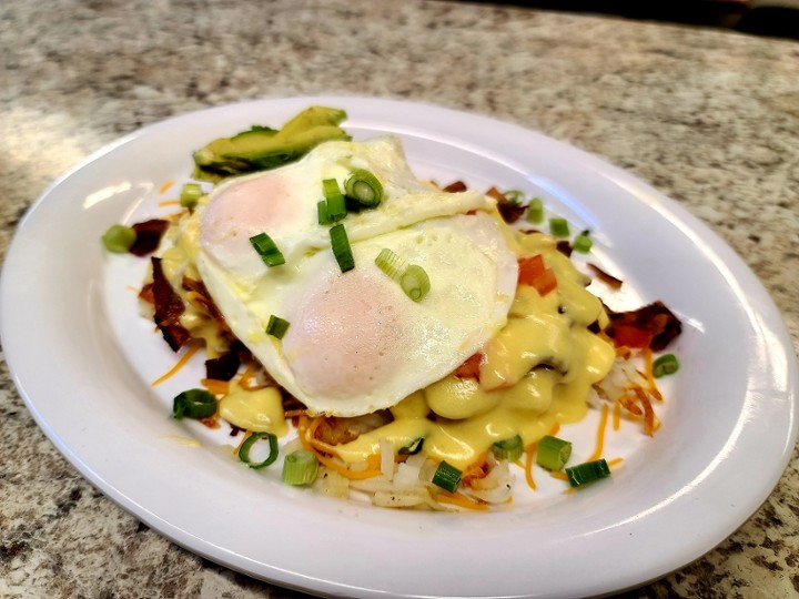 California Hashbrown Plate - Hashbrowns topped wth bacon, cheddar, avocado, tomato, green onion & hollandaise with 2 eggs  and toast or pancake
