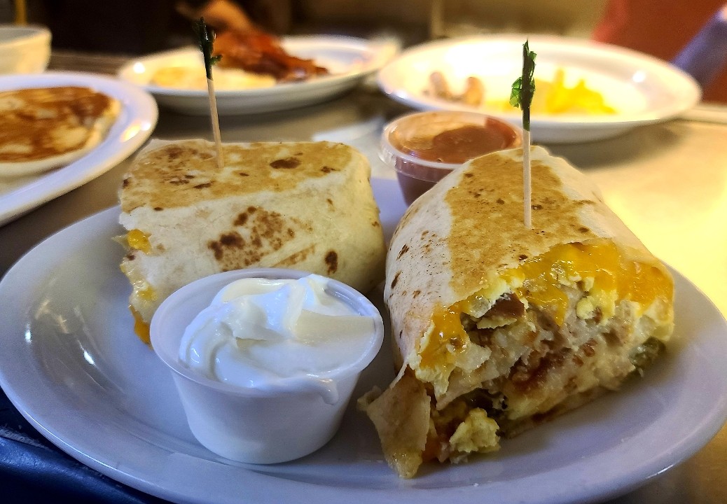 Breakfast Burrito -  Ham, Sausage, onion, jalepeno, cheddar, gravy and hashbrowns rolled into a flour tortilla
