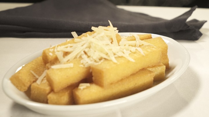 Crispy Fried Polenta topped with parmesan cheese