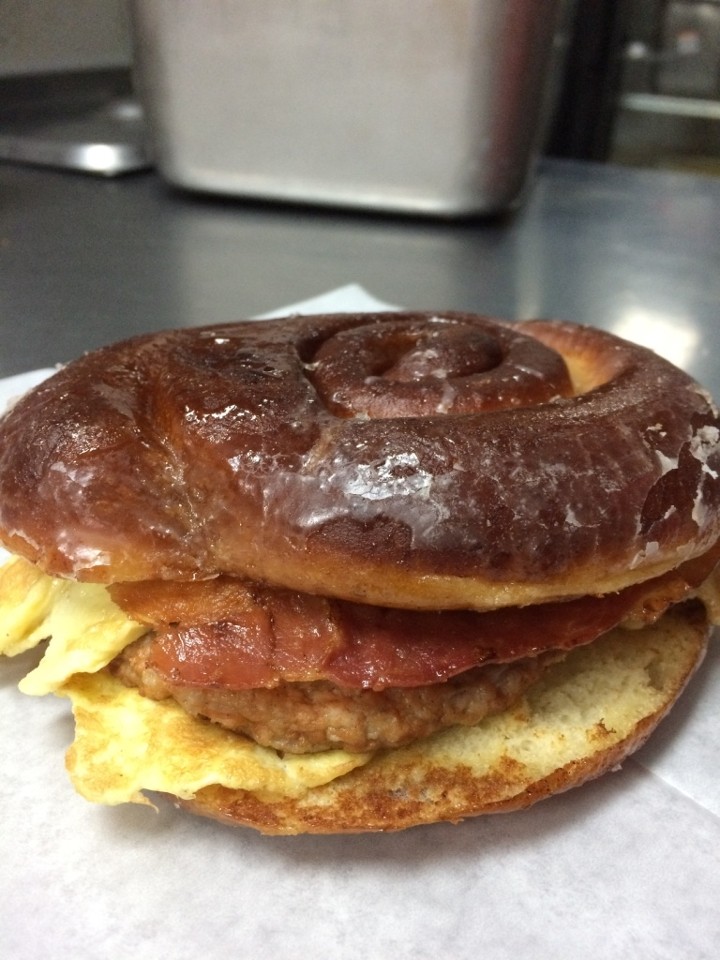 Cinnamon Roll Donut Sandwich: Bacon, Egg, Sausage, and Cheese