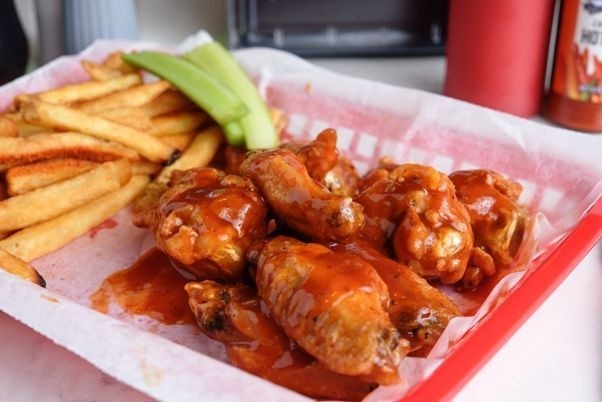 FLAVORED WINGS COMBO BONE IN - 8 Bone In Wings any Flavor, Fries & Drink Served with ranch and celery sticks
