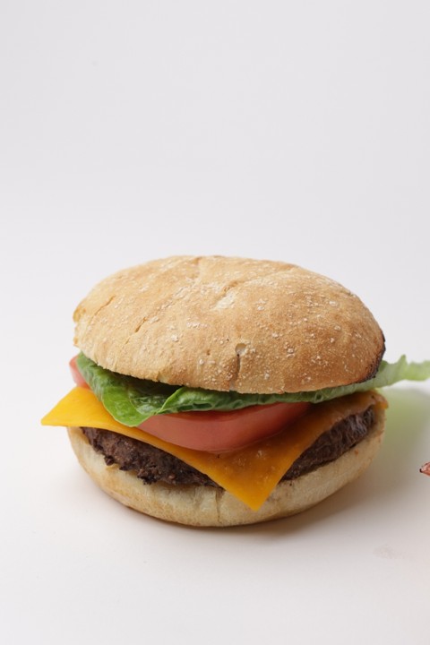 94. American Cheese Burger - Cristal bread, burger, cheddar cheese, fresh tomato, lettuce and ketchup (Cristal Bread)