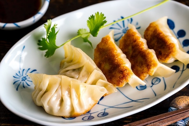 Gyoza (pork & veggie panfried  or  dumpling) with Ponzu sauce.