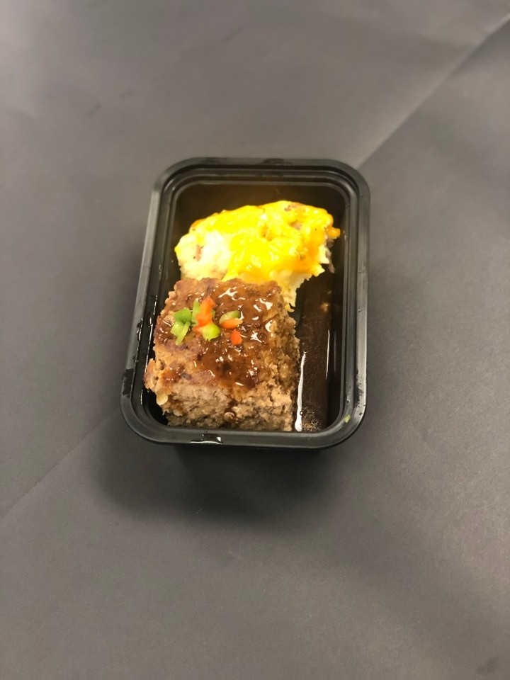 Housemade Meatloaf over Smashed Potatoes