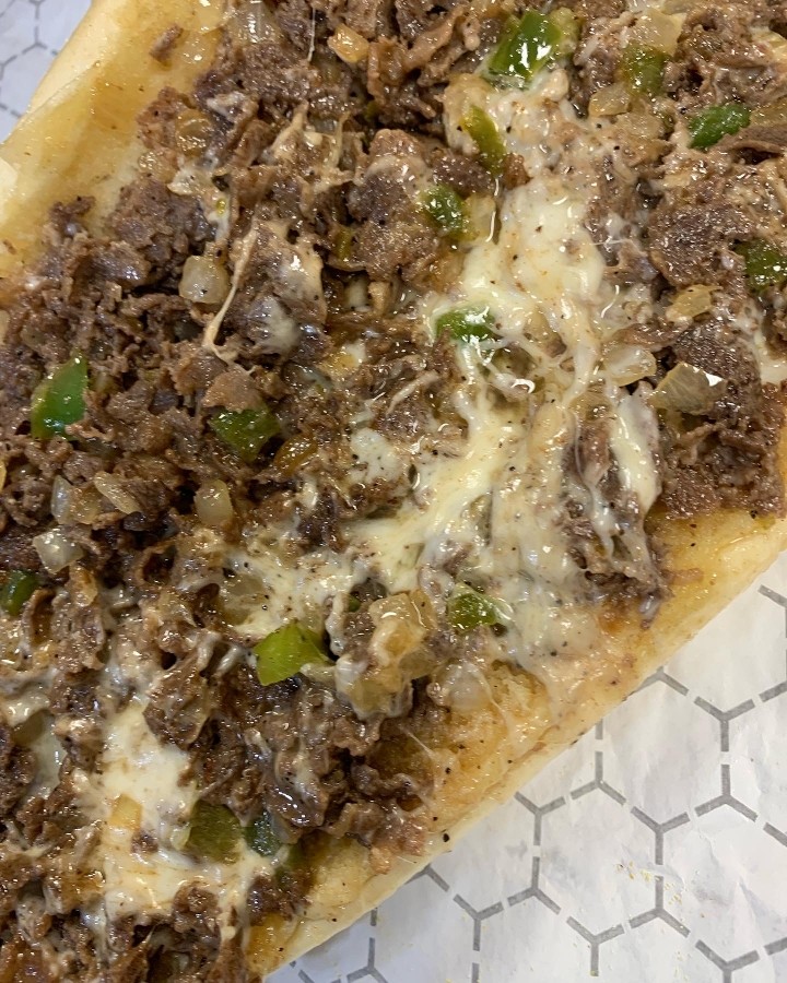 Philly cheesesteak with peppers and onions and your choice of cheese (9oz of meat on a  Amoroso roll)