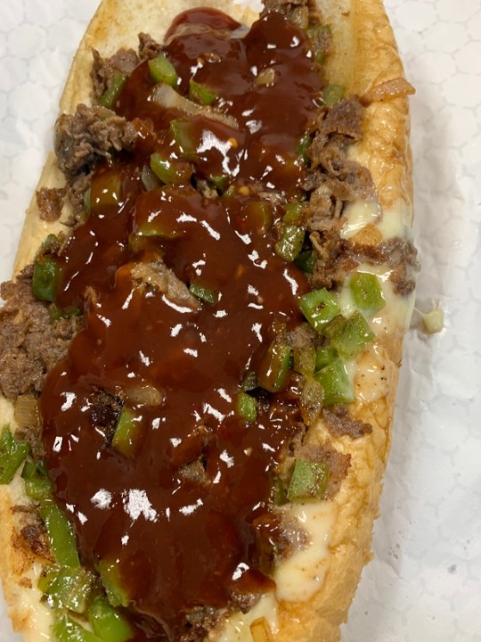 Mumbo Philly Cheesesteak with (9oz of meat on a  Amoroso roll) peppers onions and a generous amount of Mumbo sauce