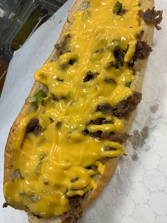 (12oz) Whiz Whipped Philly cheesesteak with peppers and onions (12oz of meat on a Amoroso roll)