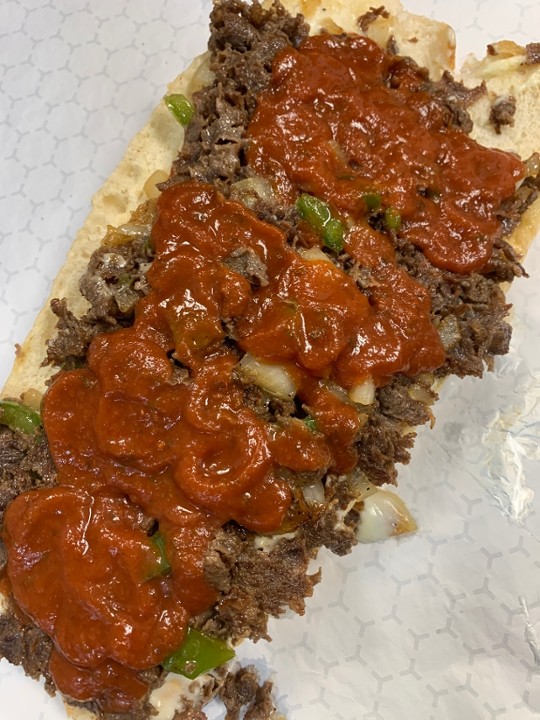 (12oz) Philly cheesesteak with peppers onions mozzarella and marinara sauce (12oz of meat on a Amoroso roll)