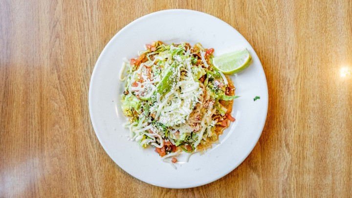 Tostada Tinga de Pollo $7.99