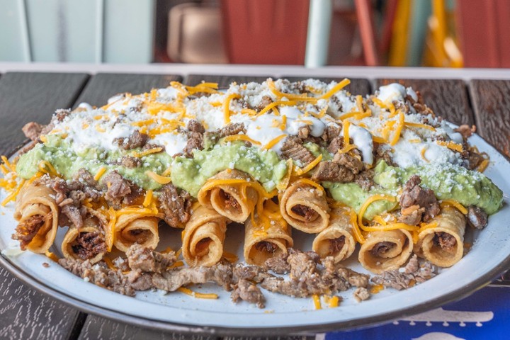 10 Beef Rolled Tacos w/ Carne On Top