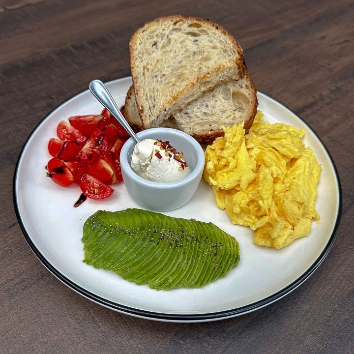 Veggie Sourdough, Cherry Tomato, Cream Cheese, Avocado, Scrambled/Poached Eggs.