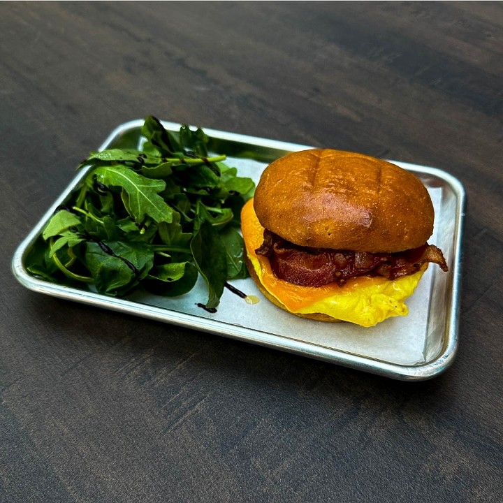 Breakfast Sandwich: Bacon, Scrambled Eggs, Cheddar Cheese, Tomato Relish, Green Salad