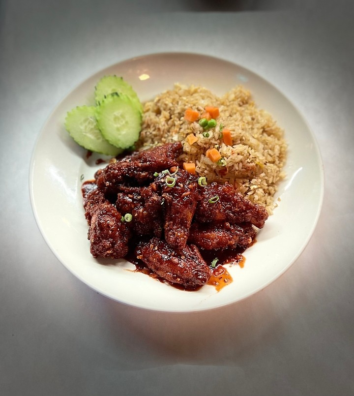 Spicy Chicken Wings & Fried Rice. (Spec go with a Soda.)
